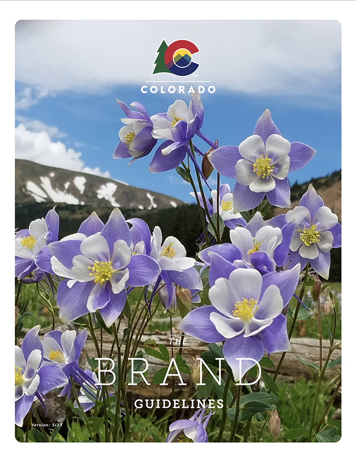 An image showing the Colorado brand guide cover updated for 2023 and showing a photo of wild Colorado purple and white Columbines in a mountain meadow.