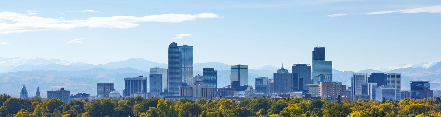 A decorative photo of the Denver, Colorado city skyline with the mountains in the background.
