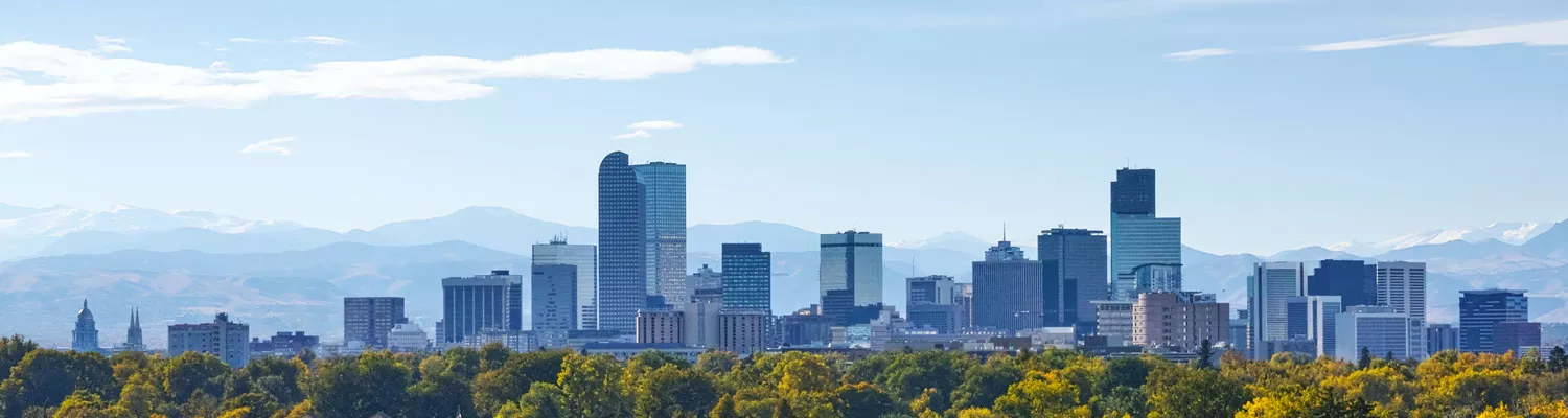 Photo of the Denver City Skyline and Mountains